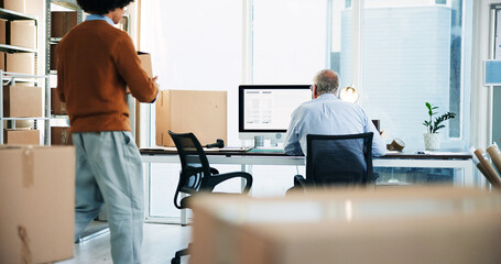 Box, computer and logistics company with business men in office together for delivery or distribution. Back, collaboration and shipping with employee people at workplace for supply chain planning