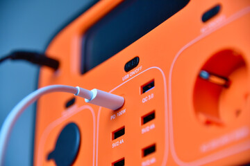 White type-c cable connected to charging station