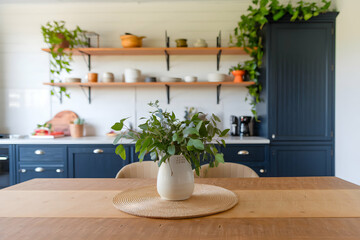 Fototapeta premium Kitchen with wooden table, blue cabinets, greenery, modern countertop, and soft lighting ambiance