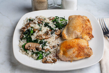 chicken thighs  with rice , mushrooms and spionach