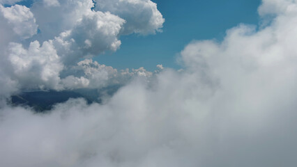 Flying through white fluffy clouds