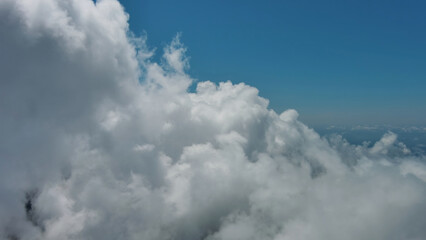 Flying through white fluffy clouds