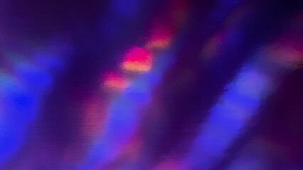 top shot of abstract pastel iridescent holographic foil background with light leaks. holo purple holo flat foil material. cool glitter surface with shiny rainbow feel. 