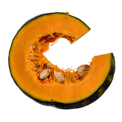 A sliced pumpkin against a black background.
The pumpkin is orange and the inside is visible, showing the seeds and fibers.