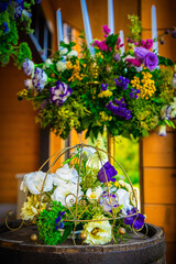 Wooden wedding interior reastaurant decoration with flowers and candles