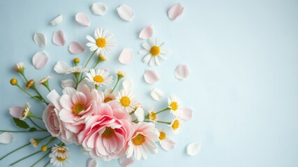 A delicate arrangement of pink blossoms and white daisies on a soft blue background, showcasing the beauty of nature's simple elegance.