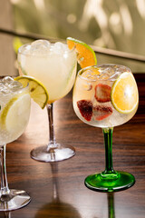 decorated drinks in cocktail glasses