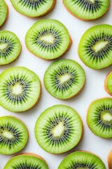 Fototapeta premium top-down view of juicy kiwi slices displayed in pattern soft studio lighting