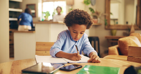 Writing, serious and child with notebook, home and boy with info, education and studying for exam. Desk, growth and development of African kid, knowledge and preparing for test with homework in house