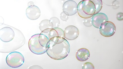 Naklejka premium Close-up of iridescent bubbles with varying sizes and shapes.