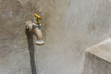 Spout with trough, sink with faucet, pipe and cement sink. Washing, drinking water, open water,...