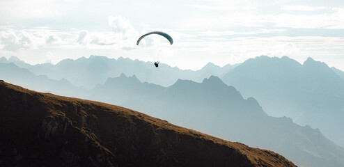 A paraglider flies into the heart of the French Pyrenees mountains