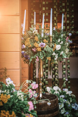 Wooden wedding interior reastaurant decoration with flowers and candles