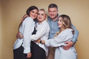 Friends share a warm embrace during a joyful gathering in a cozy indoor space