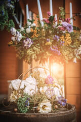 Wooden wedding interior reastaurant decoration with flowers and candles