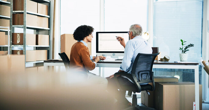 Men, talking and computer for warehouse distribution of schedule planning, order info and logistics. People, inventory and discussion for ecommerce delivery, product packaging and supply chain update