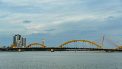 Experience the breathtaking view of the magnificent Yellow Bridge spanning the water