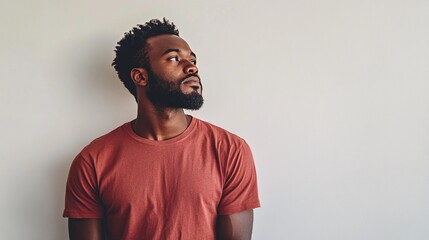 Fototapeta premium Dedicated African American Male Construction Worker in Plain Attire Engaged in Building Activities: A Representation of Hard Work and Commitment to Craftsmanship