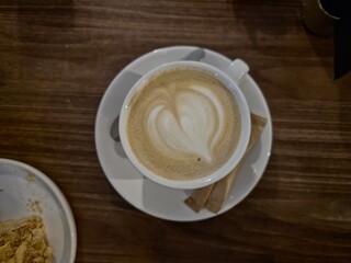 cup of coffee on wooden table