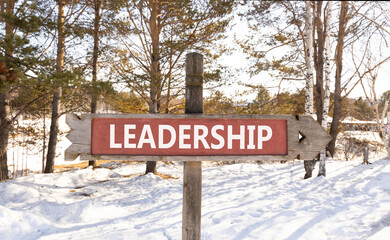 Leadership symbol. Concept word Leadership on beautiful wooden road sign. Beautiful winter forest background. Business leadership concept. Copy space.