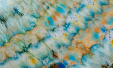 Obraz premium abstract pattern on silk fabric texture in blue, yellow, green colors