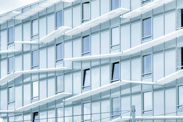 Exploring modern architectural design with glass facades and stylish balconies enhancing aesthetics