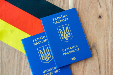 Ukrainian passport with germany flag.