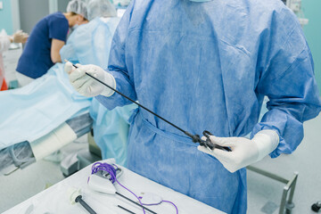 A skilled medical professional precisely prepares essential surgical instruments in a controlled...