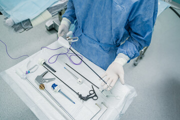 A skilled medical professional precisely prepares essential surgical instruments in a controlled...