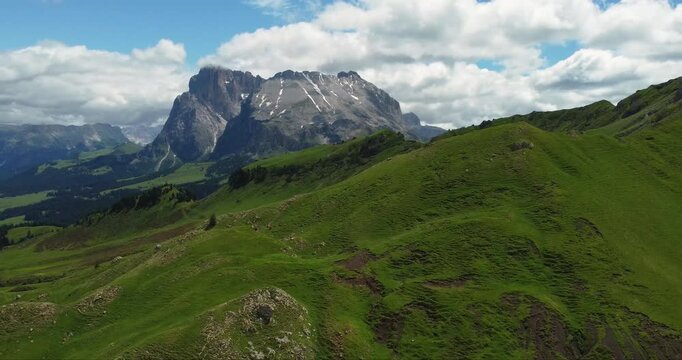 Panorama of Alpe Di Siusi near Seis Am Schlern and Compatsch with a view on Sassolungo on summer, Dolomites Mountains, Italy