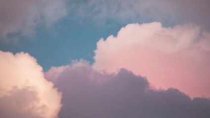 Soft pink and purple clouds against a blue sky create a serene atmosphere, perfect for backgrounds or nature themes.