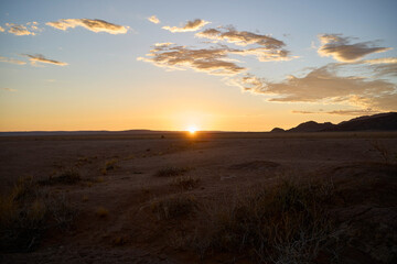 Beautiful sunset in the Namibian desert as seen while on a group tour near Sesriem.