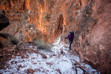 Snow Covered Rock Slide With Hiker Pausing Halfway Up