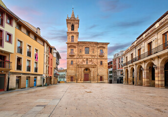 Oviedo, Spain. View of Iglesia de San Isidoro el Real located on Plaza de la Constitucion square