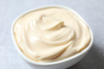 Bowl with mayonnaise on the table