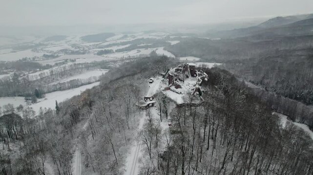 Aerial view ruins of old castle. Winter. Ruin of Hohnstein Castle, Harz mountains, Germany.