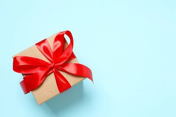 Beautiful gift box on color background