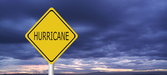 danger,caution,Hurricane Idalia warning sign against a powerful stormy background with copy space. Dirty and angled sign with cyclonic winds add to the drama.hurricane season sign on cloudy background