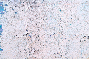 Obraz premium Pale pink and blue peeling paint on the old rough concrete surface, texture background of peeling paint
