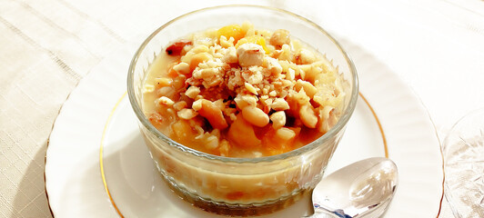 Ashure dessert with legumes and dried fruits named aşure or asure . Noah’s pudding in the bowl.