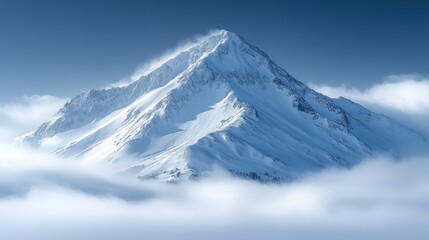 Obraz premium A majestic snow-covered mountain peak rises above a sea of clouds under a clear blue sky.