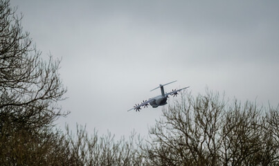 ZM401 RAF Royal Air Force Airbus C.1 A400M Atlas military transport plane flying away from a...