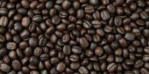 Obraz premium Dark roasted coffee beans isolated on black background, bitter, grains, aroma