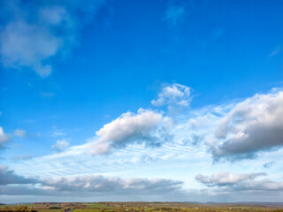 Sky and clouds for a background for a photo.A scene with a dramatic sky. Dark clouds blend with...
