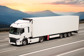 Obraz premium Refrigerated Cargo Truck for Sensitive Deliveries In Motion On Mountain Highway