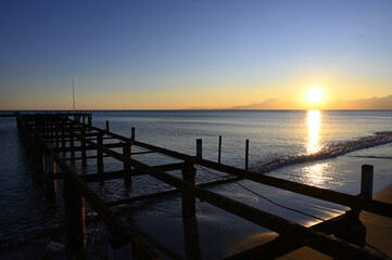 Obraz premium old and disused iron pier extending towards the sea