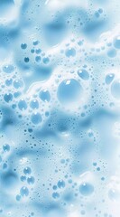 A close-up of blue foam with bubbles on it, against a white background.