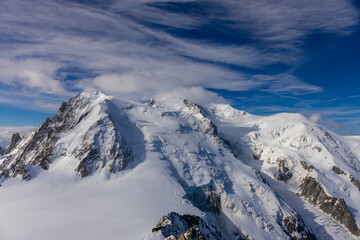 Mont Blanc, Monte Bianco mountain summit in the Alps. The highest mountain in Europe. Snow and glacier covered high altitude snow mountain in the Alps. The top of Montblanc Chamonix valley landscape