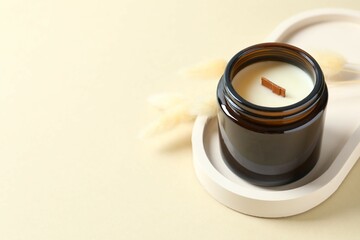 Handmade scented candle in a glass. Soy wax candle with a wooden wick