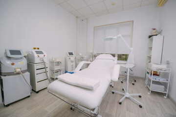The interior of the massage and cometology salon, massage table. Nobody.